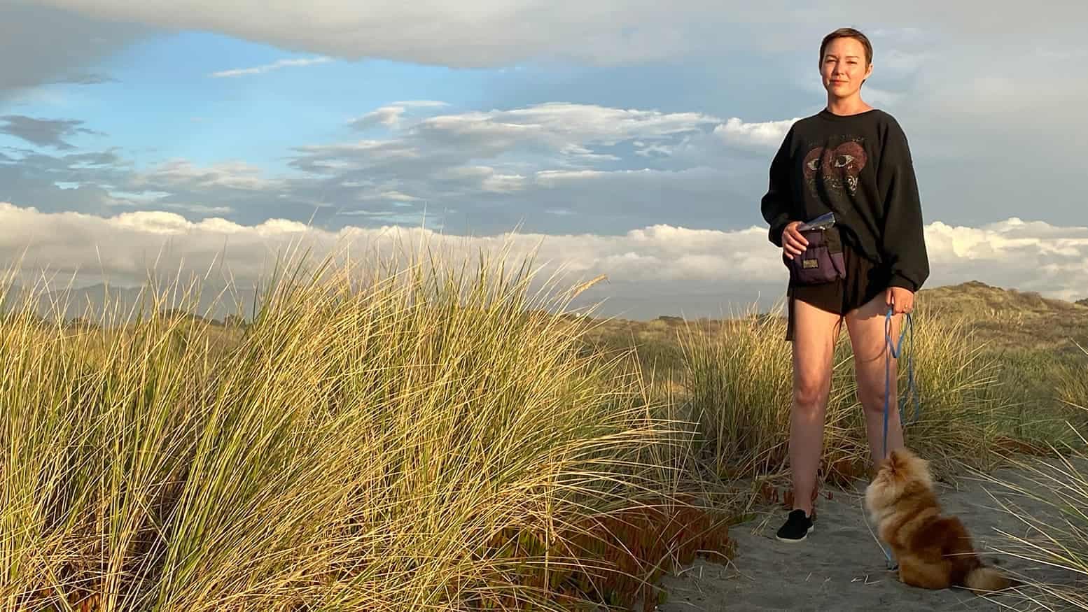 Heather and Meeko on a beach sand dune trail.